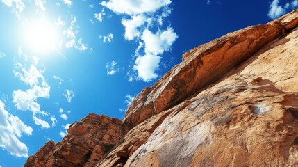 Obraz premium Rock climbing under bright blue sky, high-energy shot