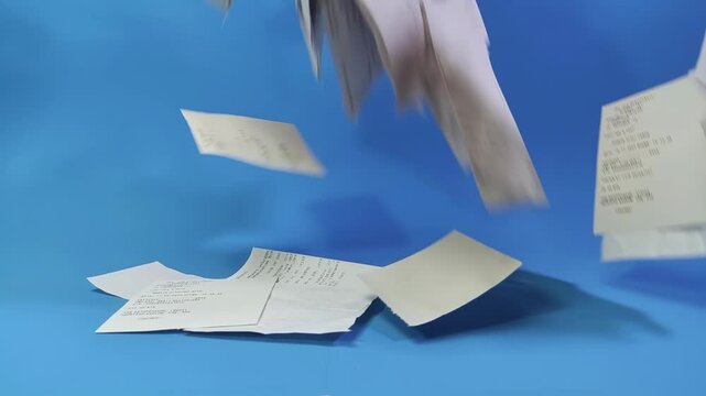 Sales receipts. Flying grocery receipts for groceries from the store. Financial stress and expense management challenges