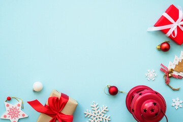 Christmas background. Christmas present boxes and holiday decorations at blue. Flat lay image with copy space.