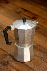 moka pot on wooden board background
