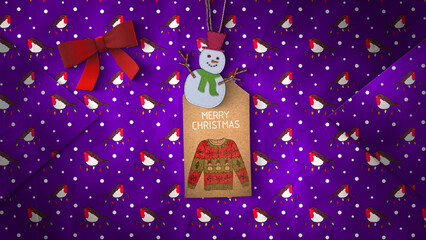 A festive background of Christmas wrapping paper and gift tag.