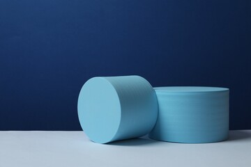 Blue podiums on color background 