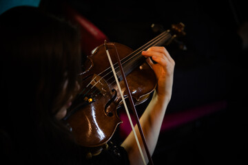 Closeup of hands playing violin
