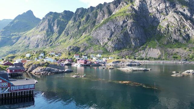 Historic fishing village in front of the mountain landscape of the Lofotodden National Park. A i Lofoten in the Lofoten district in Norway