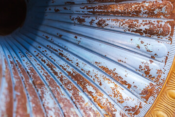 Vintage gramophone horn with blue peeling paint, close up