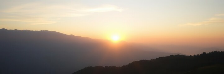 Fototapeta premium Tranquil sunrise over majestic mountain ranges in serene natural landscape promoting spiritual harmony at dawn, harmony, majestic
