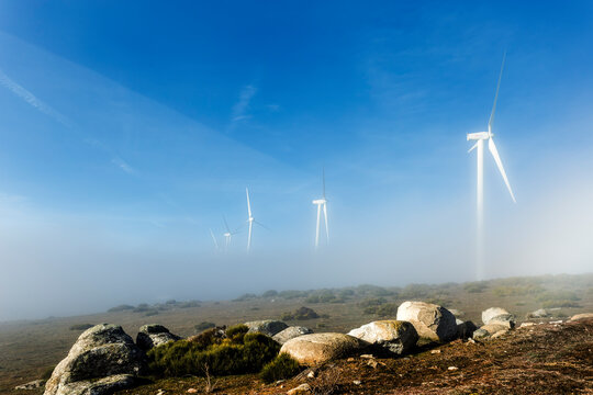 Windmills in the fog at Pucheruelo eolico parck