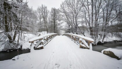 Snowy, wooden bridge in a winter day. Stare Juchy, Poland 