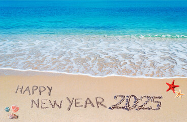 happy new year 2025 written on the shore