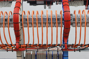 Combining electrical insulated wires with plastic ties.