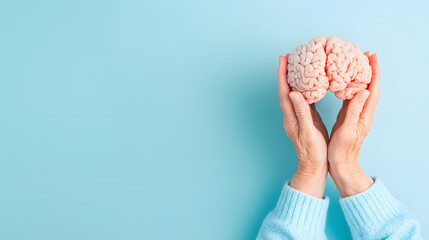 A compelling of a brain in senior hands, symbol of healthcare, mindfulness, and aging. Ideal for designs focusing on brain preservation, dementia care, and healthy aging themes with ample text space.