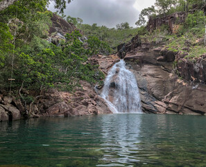 A Magnificent and Serene Waterfall That Is Beautifully Surrounded by Lush and Vibrant Greenery