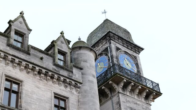 clock tower dunrobin castle medieval architecture luxurious property reflects rich history estate inverness uk panning shot scene visuals heritage aesthetics 