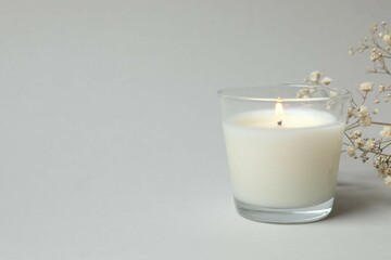 Scented candle with on gray background 