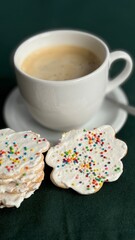 Cup of coffee with homemade Christmas cookies.