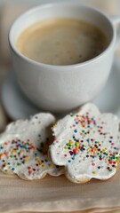 Cup of coffee with homemade Christmas cookies.