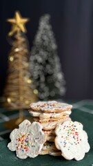 Delicious homemade Christmas cookies on the table with decorative Christmas background.