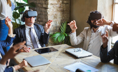 Business people wearing vr goggles inside office - New AI technology and metaverse concept - Main focus on senior man face