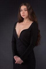 Fashion portrait of pretty woman in black dress