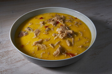 Spicy tripe soup on a wooden board
