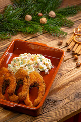 Traditional Christmas dinner in Czech Republic - fried carp with potato salad