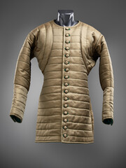 Historical fashion. Medieval knight cloth. Padded jacket gambeson.