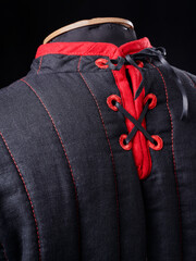 Historical fashion. Medieval knight cloth. Padded jacket gambeson.