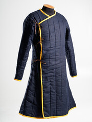 Historical fashion. Medieval knight cloth. Padded jacket gambeson.