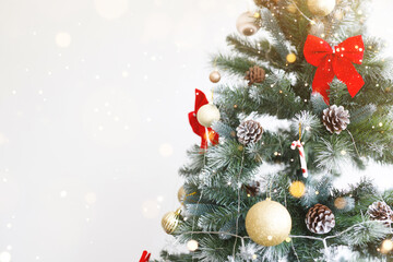 Closeup of bauble colorful variety hanging from a decorated christmas tree on blurred of lights with decorated tree, sparkling and bokeh background. copy space for your text. Christmas Tree Decoration