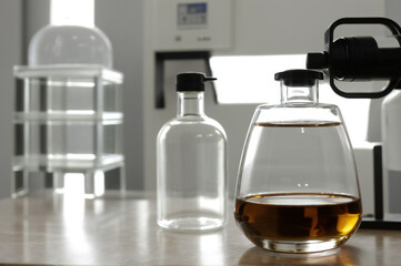 Close-up of a scientist's tube with liquid in a lab