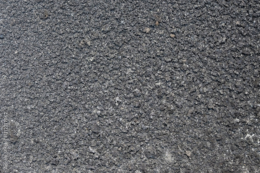 Poster the shape, pattern and soft texture of dry moss on the concrete floor. black dry moss looks grunge. 
