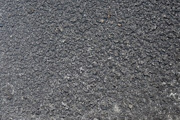 The shape, pattern and soft texture of dry moss on the concrete floor. Black dry moss looks grunge. Broken moss surface.Natural pattern and texture background for graphic design