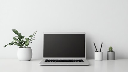 Fototapeta premium A laptop computer, two pencils in a white cup, and two plants on a white desk in front of a white wall.