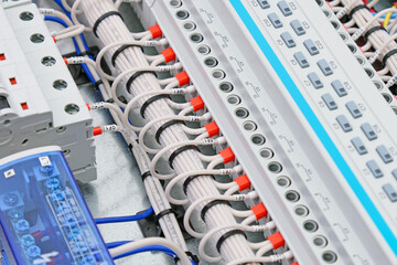 Connection of electrical modules using insulated mounting wires. Close-up. Soft focus.