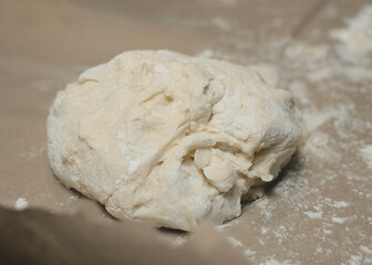 Soft dough on kitchen countertop.