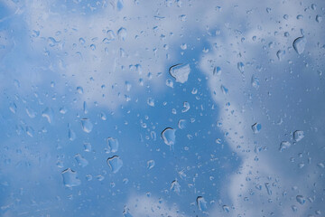 Abstract shapes, patterns and textures of plastic water droplets on a blue sky background. Copy space for graphic design. Natural pattern and texture background. Transparent plastic roof - Powered by Adobe