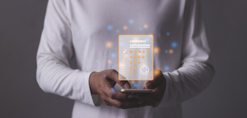 Customer Satisfaction, Young Man hand using smartphone mobile with five star to review and give 5...