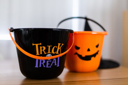 halloween buckets sitting on a table - Powered by Adobe