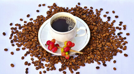 cup of coffee, in roasted coffee beans background 
