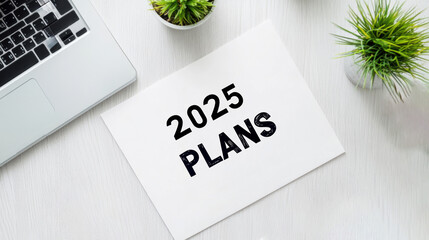 Planning for future goals with 2025 plans on a desk