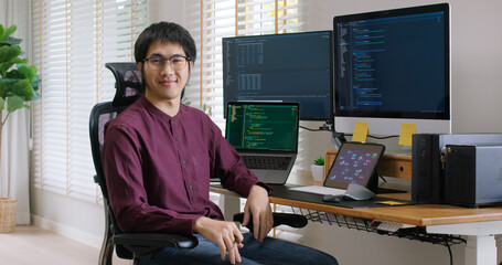 Digital transformation future workforce web DEV career. Asia people young talent man relax smile look at camera remote work at home office reskill upskill job on AI cloud computing cyber security. © ChayTee