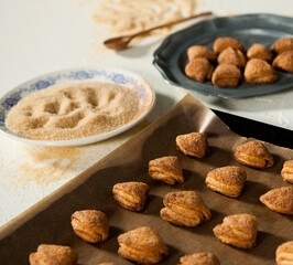 hands of a woman preparing biscuits or cakes in the kitchen