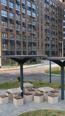 empty area in the courtyard residential area with permanent places for outdoor chess, comfortable living environment in a modern apartment complex