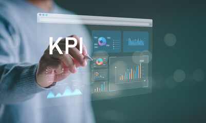 Analyzing Key Performance Indicators. Businessman using virtual screen to analyze key performance indicators KPI with various graphs and charts, showcasing data analysis and performance tracking.