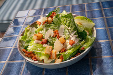 Caesar salad with crispy bacon and parmesan cheese