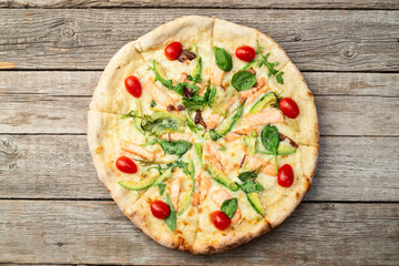 Italian pizza with avocado salmon  tomatoes and mozzarella photography. top view