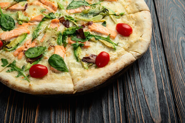 Italian pizza with avocado salmon  tomatoes and mozzarella photography. top view