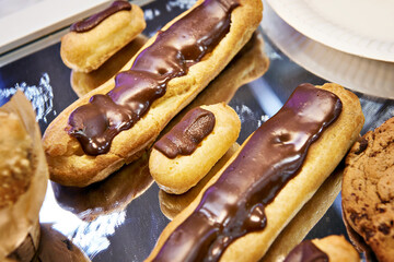 Eclairs in pastry shop