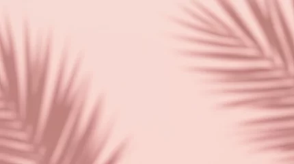 Fototapete Badezimmer Abstract minimalist background with soft shadows of palm leaves on a pastel pink surface. Elegant and stylish design suitable for the beauty industry, branding, social networks, cosmetics advertising.  © Oleksandr