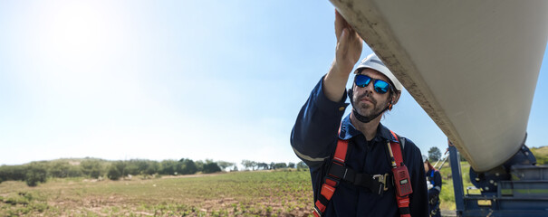 Inspection engineers a rotor blade of a wind turbine. Professional Man Maintenance engineers...